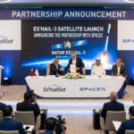 Es’hailSat and SpaceX representatives shaking hands at a partnership announcement event for the ES’Hail-3 satellite launch