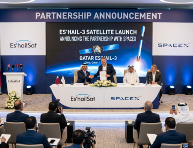Es’hailSat and SpaceX representatives shaking hands at a partnership announcement event for the ES’Hail-3 satellite launch